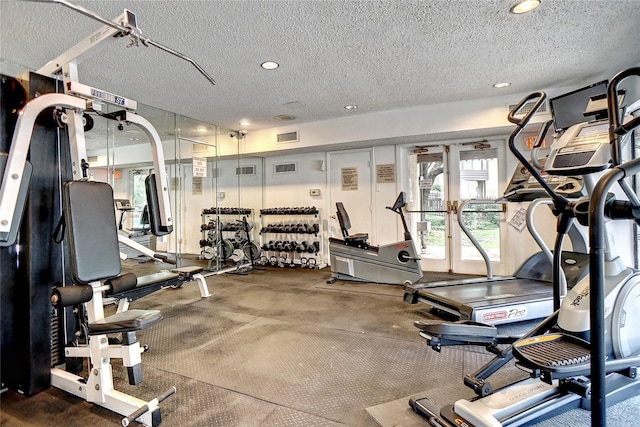 workout area with a textured ceiling