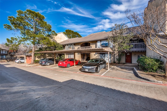 view of front of property with a carport