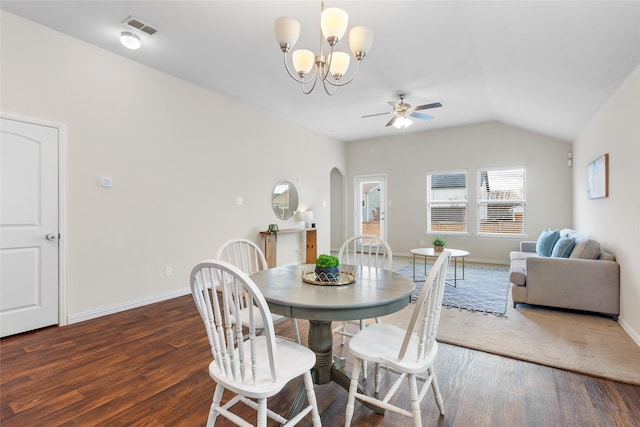 dining room featuring lofted ceiling, dark wood-type flooring, and ceiling fan with notable chandelier