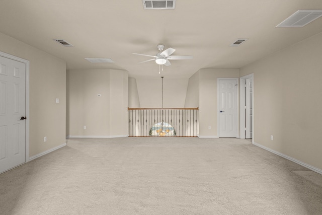 carpeted empty room featuring ceiling fan