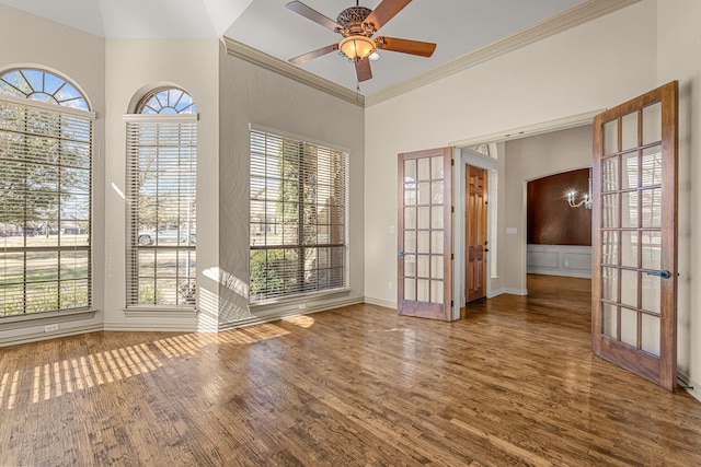 spare room with ceiling fan, french doors, ornamental molding, and hardwood / wood-style floors