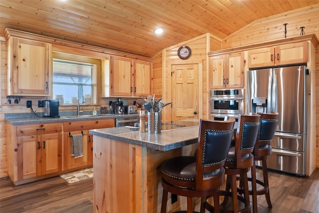 kitchen with wood ceiling, stainless steel appliances, dark hardwood / wood-style floors, vaulted ceiling, and a center island