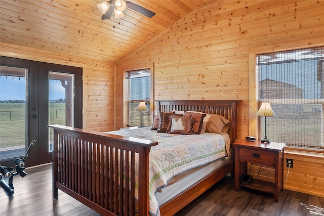 bedroom featuring hardwood / wood-style floors, wood ceiling, french doors, wooden walls, and ceiling fan