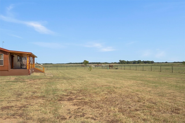 view of yard with a rural view