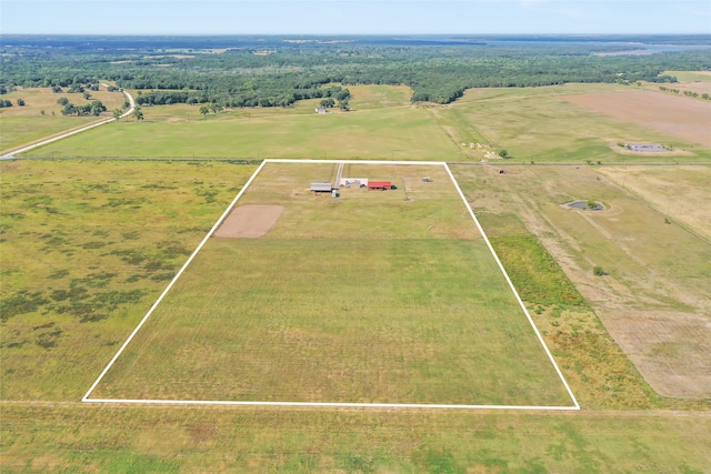 birds eye view of property with a rural view