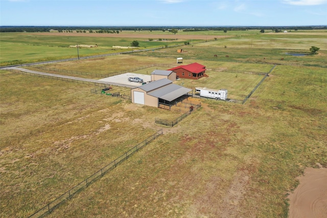 birds eye view of property with a rural view