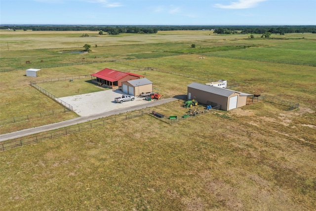 birds eye view of property with a rural view