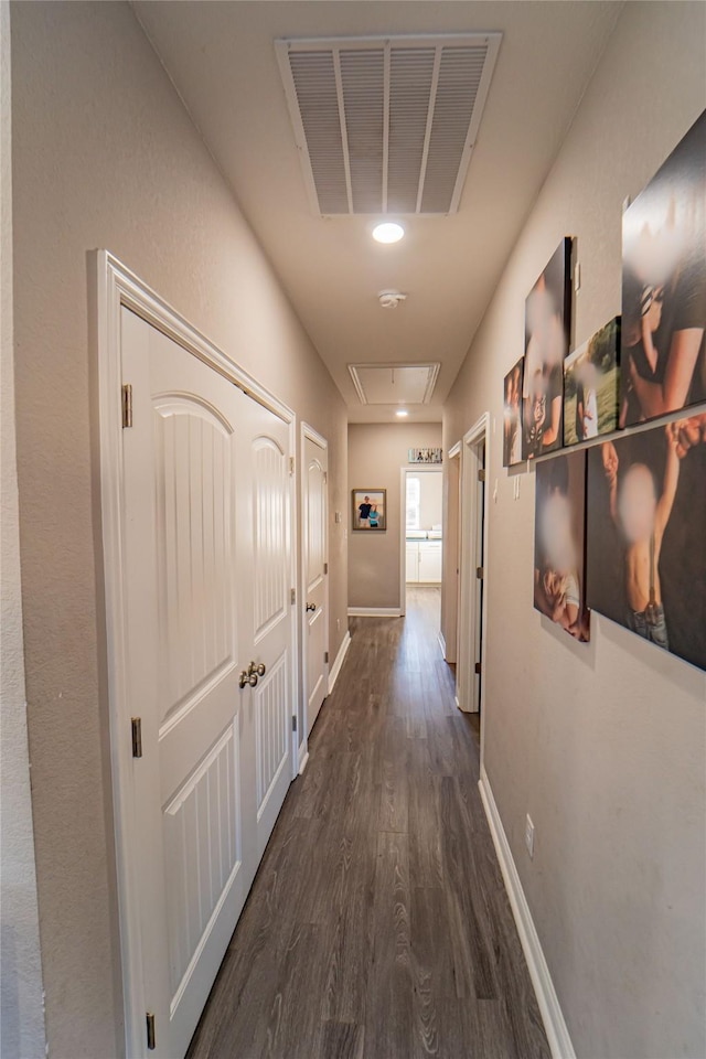 hall with dark hardwood / wood-style floors