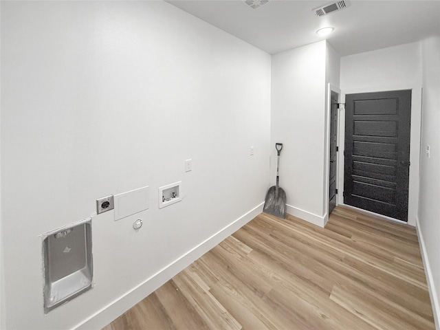 clothes washing area with washer hookup, hardwood / wood-style flooring, gas dryer hookup, and electric dryer hookup