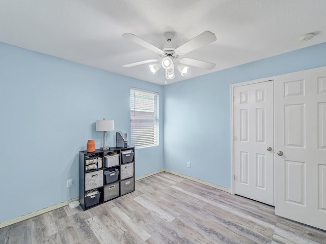 bedroom featuring a closet, ceiling fan, and light hardwood / wood-style floors