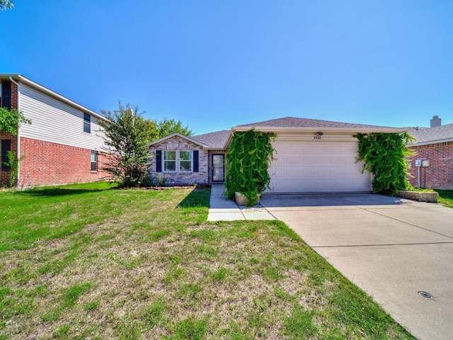 ranch-style home with a garage and a front lawn