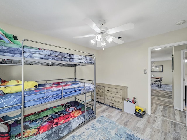 bedroom featuring light hardwood / wood-style floors and ceiling fan