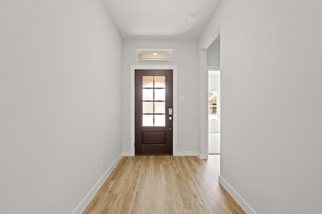 entryway with light hardwood / wood-style floors