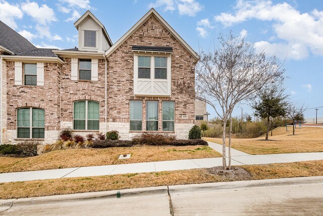 view of side of property with a yard