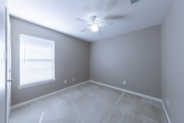 empty room with ceiling fan and carpet flooring