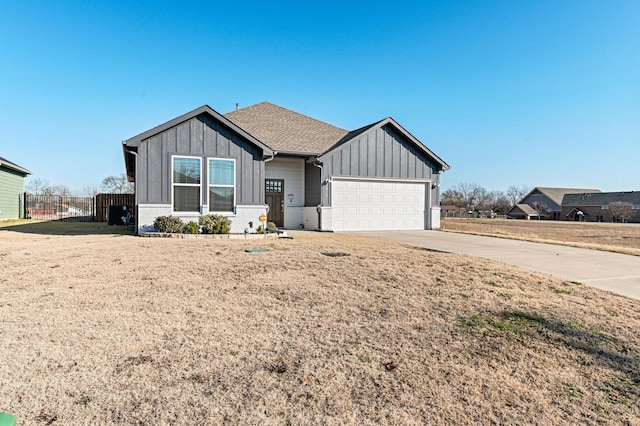 view of front of home with a garage and a front yard