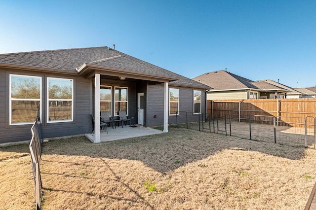 rear view of property featuring a patio