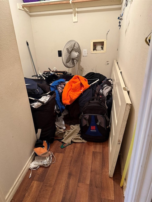 washroom with wood-type flooring and washer hookup