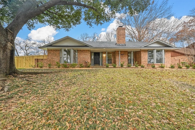 ranch-style home with a front lawn