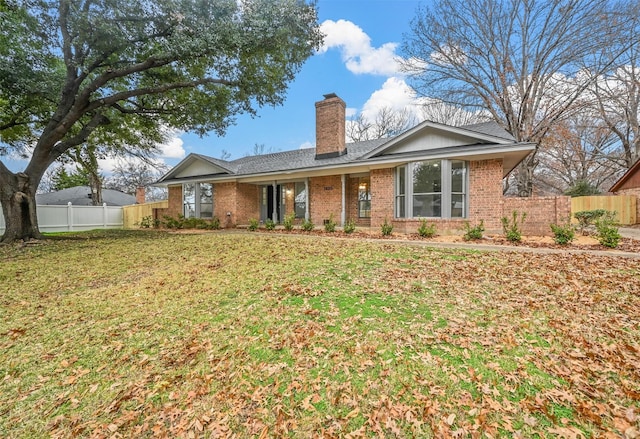 rear view of house with a lawn