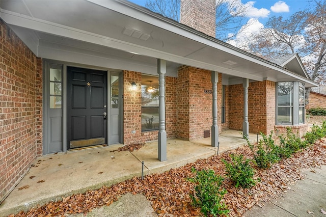 doorway to property featuring covered porch