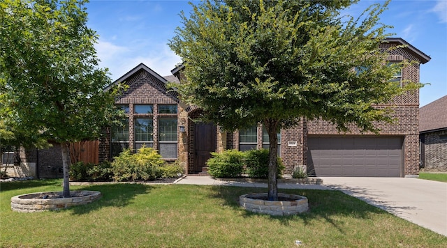 view of front facade with a front lawn and a garage