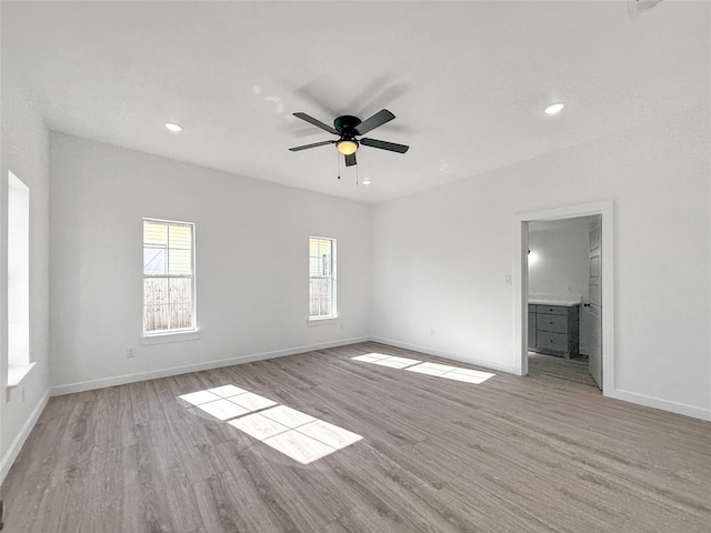 spare room featuring ceiling fan and light hardwood / wood-style floors