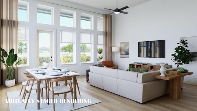 living room with ceiling fan and light hardwood / wood-style floors