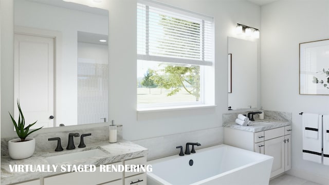 bathroom with a tub to relax in and vanity