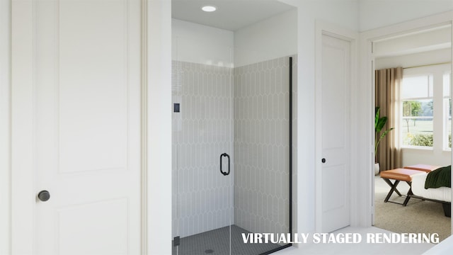 bathroom featuring a shower with door