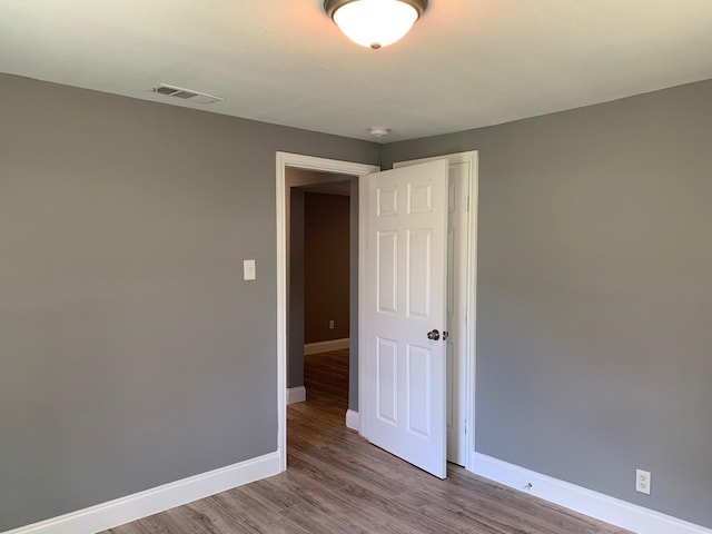 spare room with light hardwood / wood-style flooring