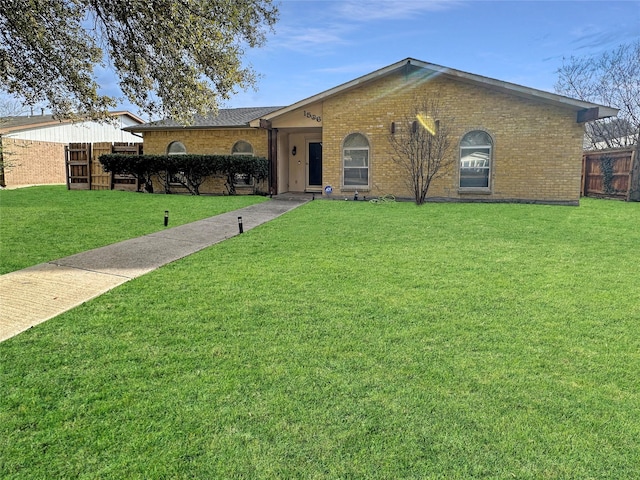 ranch-style house with a front lawn