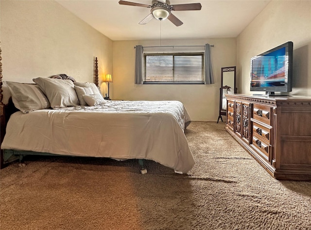 bedroom featuring ceiling fan and carpet