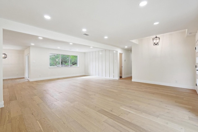 interior space featuring light wood-type flooring and a chandelier