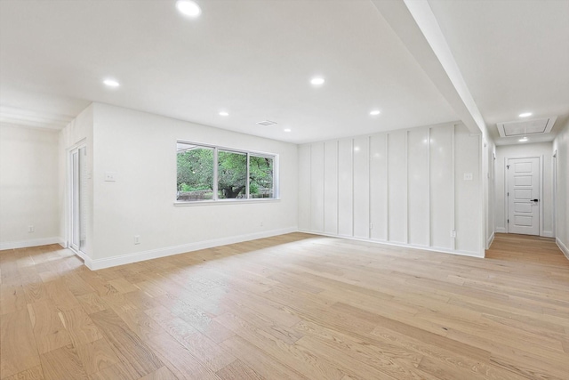 unfurnished room with light hardwood / wood-style floors