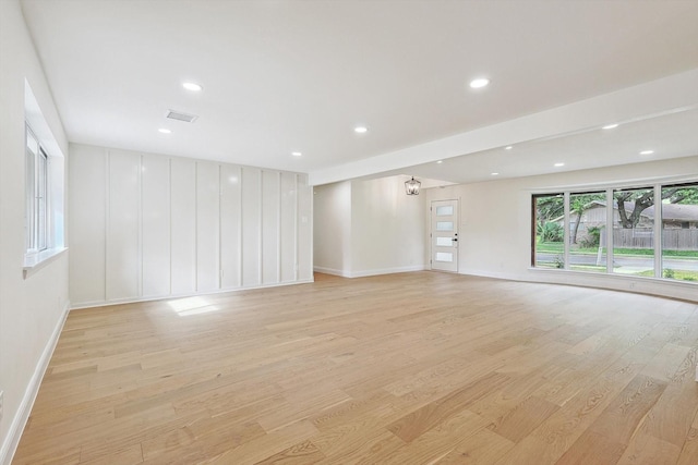 spare room with light hardwood / wood-style flooring