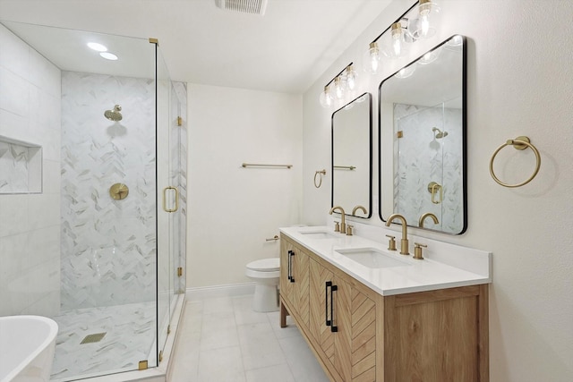 full bathroom featuring toilet, vanity, and separate shower and tub