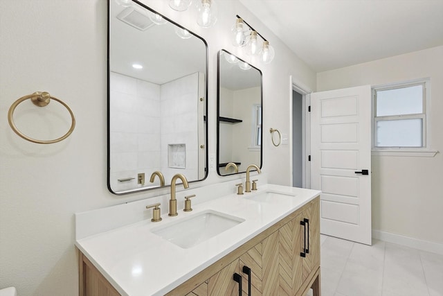 bathroom featuring tile patterned floors and vanity