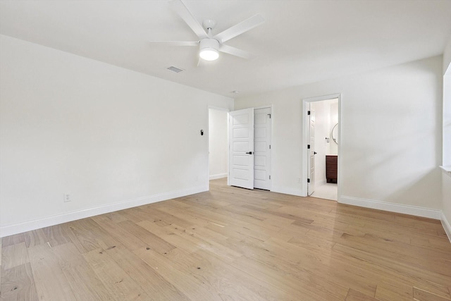 unfurnished bedroom with ceiling fan, ensuite bathroom, and light hardwood / wood-style floors