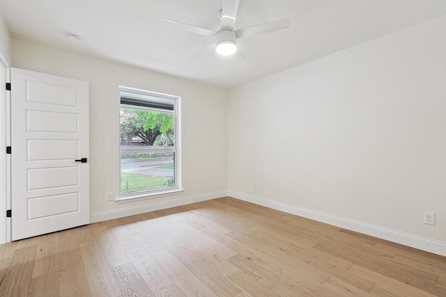 unfurnished room featuring ceiling fan and light wood-type flooring