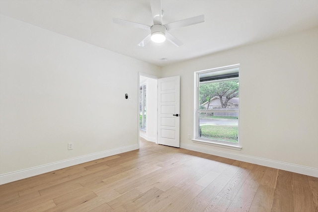 spare room with ceiling fan and light hardwood / wood-style flooring