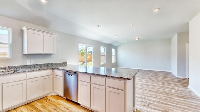 kitchen with white cabinets, dishwasher, and kitchen peninsula