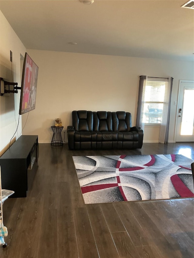 living room featuring dark hardwood / wood-style flooring