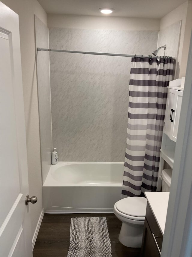 full bathroom with wood-type flooring, toilet, vanity, and shower / tub combo with curtain