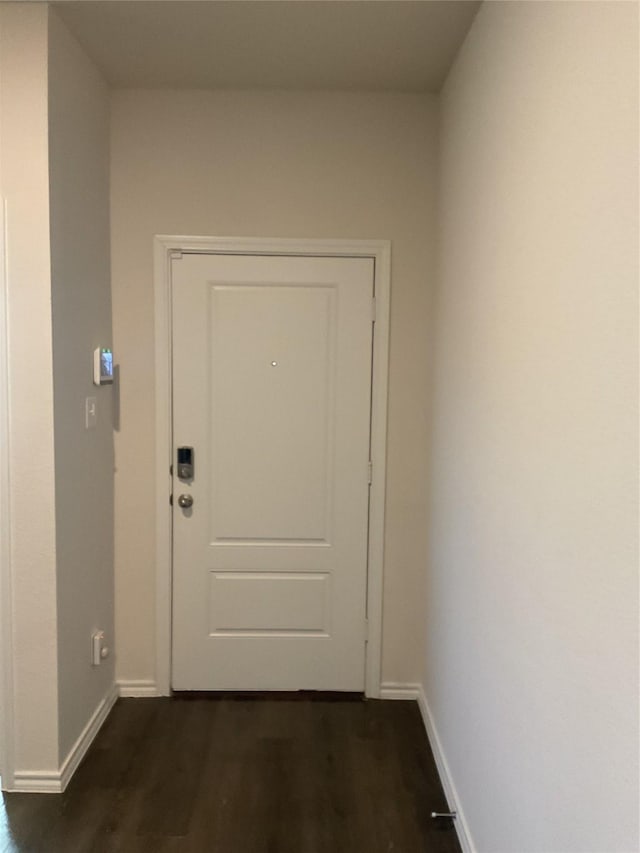 entryway with dark wood-type flooring