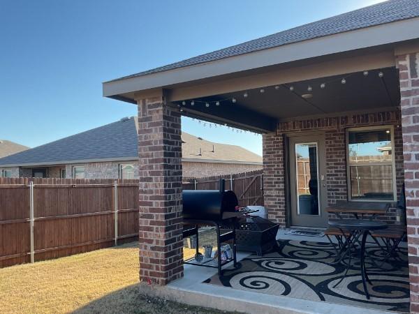 view of patio featuring a grill