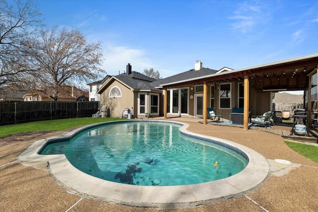 view of swimming pool with a patio