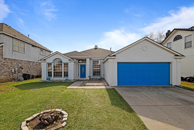 view of front of home featuring a front yard, central AC, and a garage