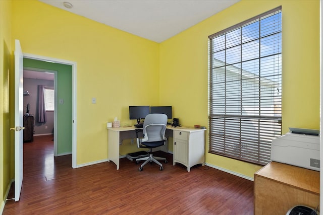 office with dark wood-type flooring