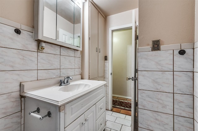 bathroom featuring vanity, tile walls, and tile patterned floors